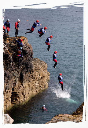 People jumping into the sea