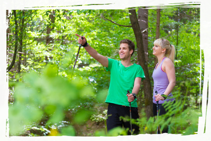 Two people walking in the forrest