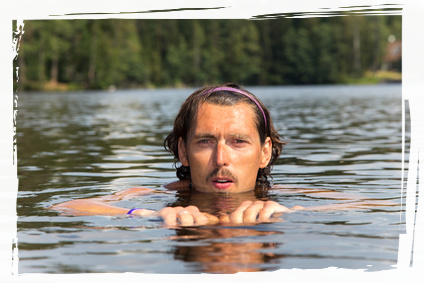 Man swimming outdoors