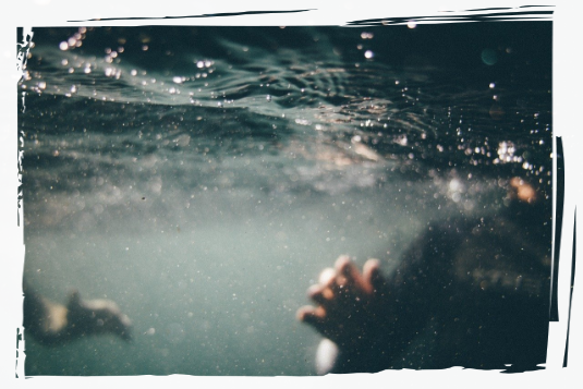 Swimming underwater People swimming underwater