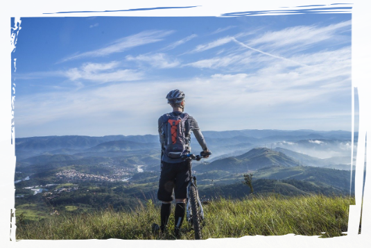 Person Cycling on the hills