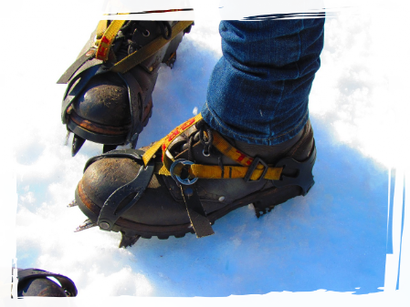 Crampons in snow Low grade crampons on the snow