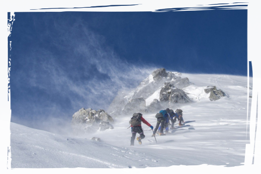 People climbing a snowy mountain