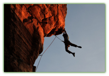 Person hanging from Rock