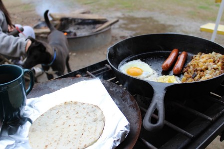 eggs and sausages in frying pan