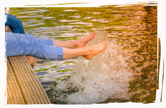 Being outdoors Dipping feet into the water