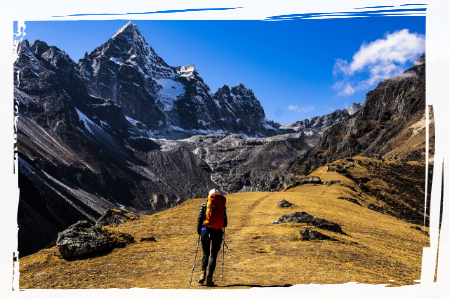 Person hiking up mountain