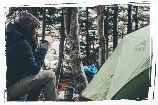 Sipping coffee near tent